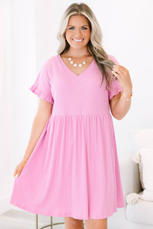 Plus Size pink textured v-neck dress with short ruffle sleeves and a tiered skirt.