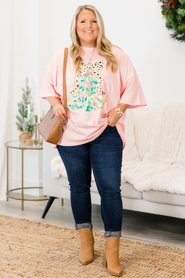 Chic Soul plus size clothing, short-sleeve dusty pink boyfriend tee with scoop-neckline and graphic watercolor christmas tree graphic with white and black polka dotted bow on the top of the tree