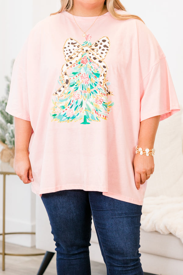 Chic Soul plus size clothing, short-sleeve dusty pink boyfriend tee with scoop-neckline and graphic watercolor christmas tree graphic with white and black polka dotted bow on the top of the tree