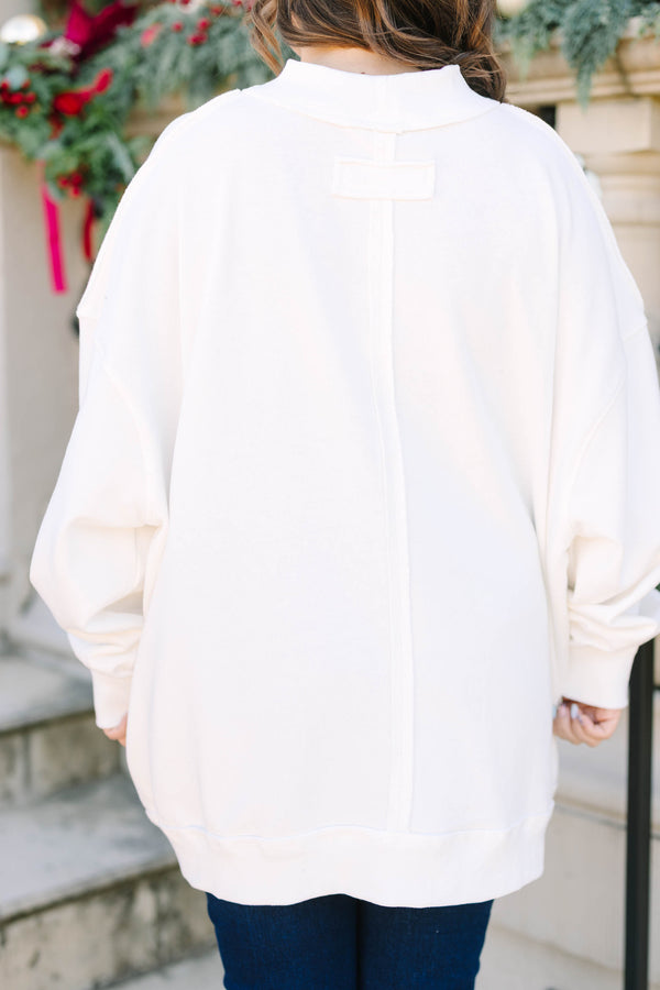 Plus size ivory mock neck pullover with a vintage red Christmas tree graphic.