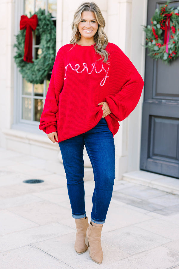 Plus size red oversized knit Merry Little Moment Sweater with white cursive embroidery.