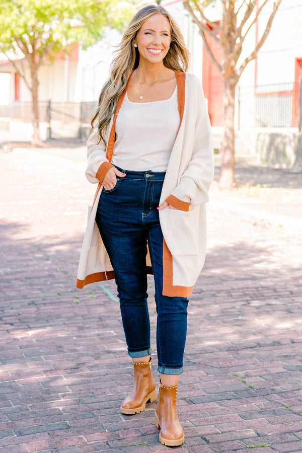 Chic Soul Plus size Clothing, cream long sleeve cardigan with a camel colored stripe going down the insides of the cardigan at the end of each sleeve and along the bottom 