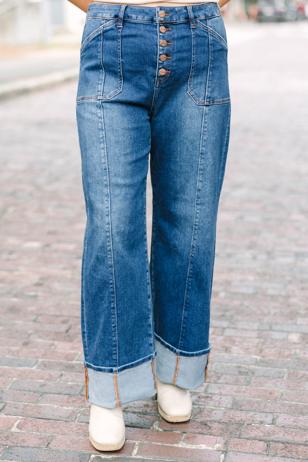 Plus Size dark wash wide leg jeans with a button fly, front seam details, and versatile cuffed hems.