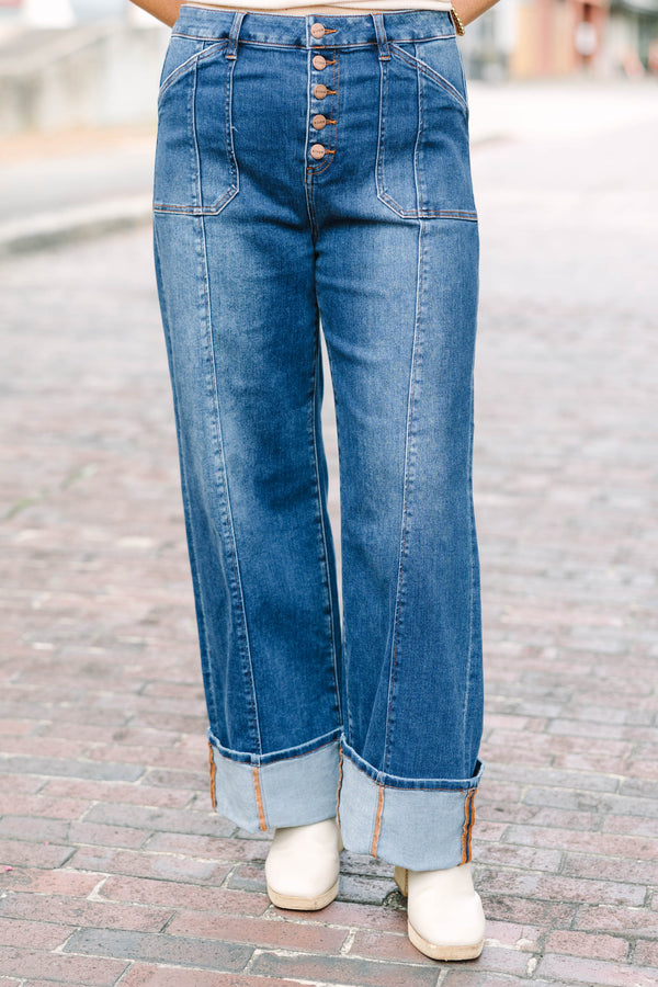 Plus Size dark wash wide leg jeans with a button fly, front seam details, and versatile cuffed hems.