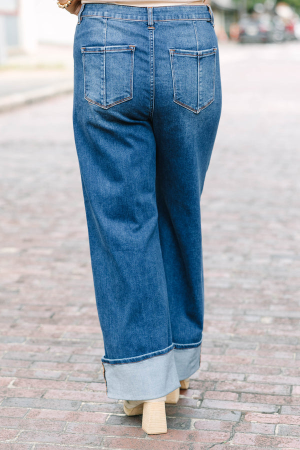 Plus Size dark wash wide leg jeans with a button fly, front seam details, and versatile cuffed hems.