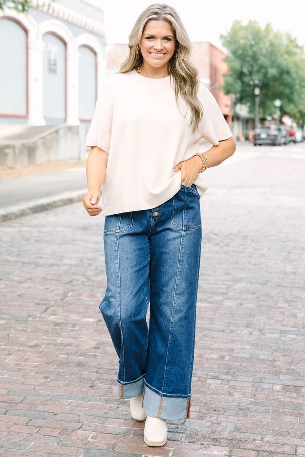 Plus Size dark wash wide leg jeans with a button fly, front seam details, and versatile cuffed hems.