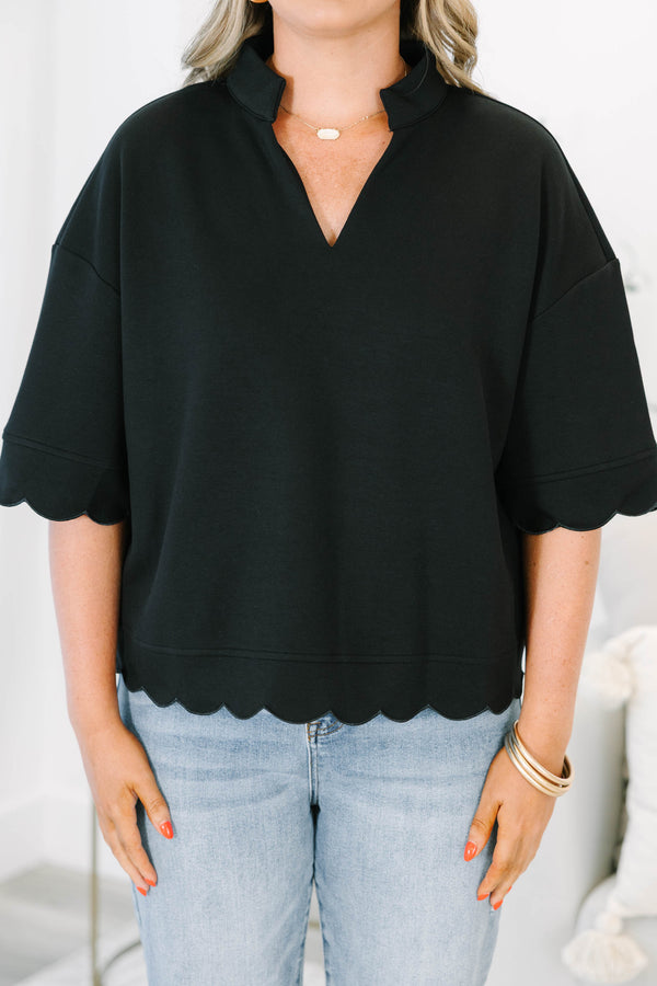 Plus Size black v-neck top with a crisp collar and elegant scalloped trim on the sleeves and hem.