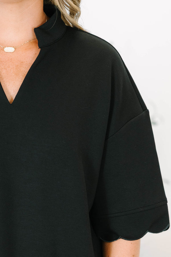 Plus Size black v-neck top with a crisp collar and elegant scalloped trim on the sleeves and hem.