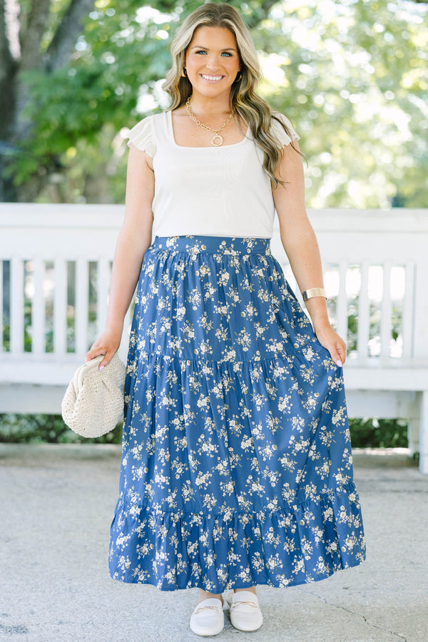Plus Size navy floral tiered maxi skirt with an elastic waistband and functional pockets.