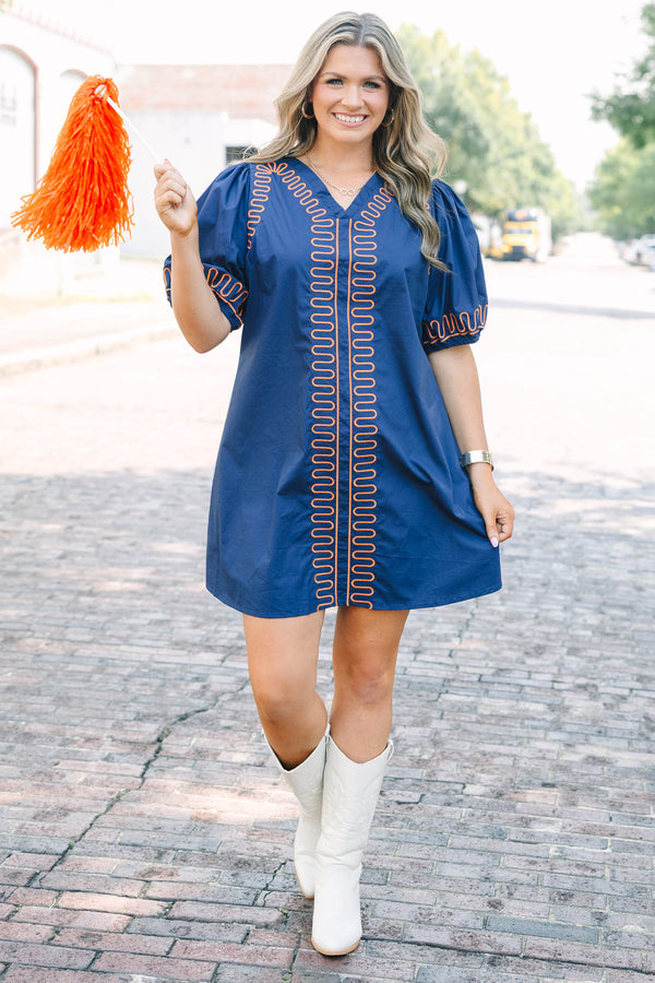Plus Size blue cotton V-neck dress with orange zigzag embroidery and elastic puff sleeves.