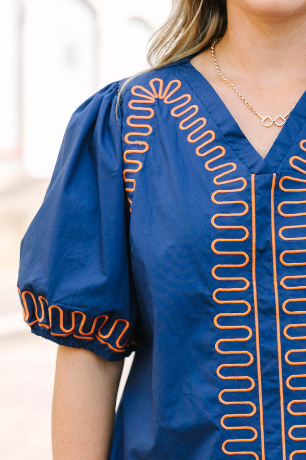 Plus Size blue cotton V-neck dress with orange zigzag embroidery and elastic puff sleeves.
