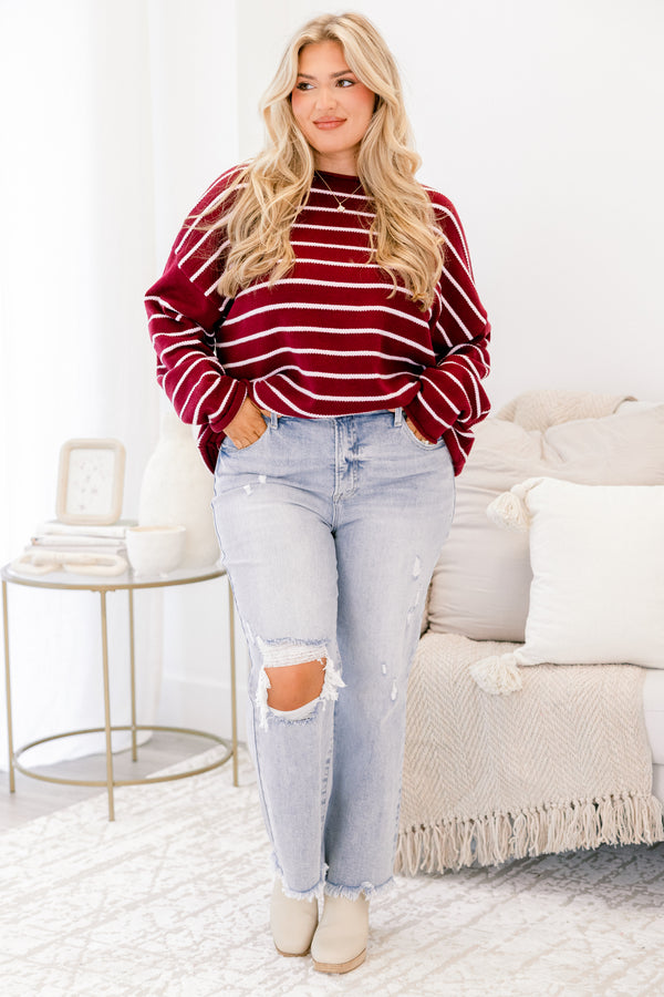 Chic Soul plus size clothing, light wash jeans with distressed details throughout and a hole in the right knee as well as two front pockets