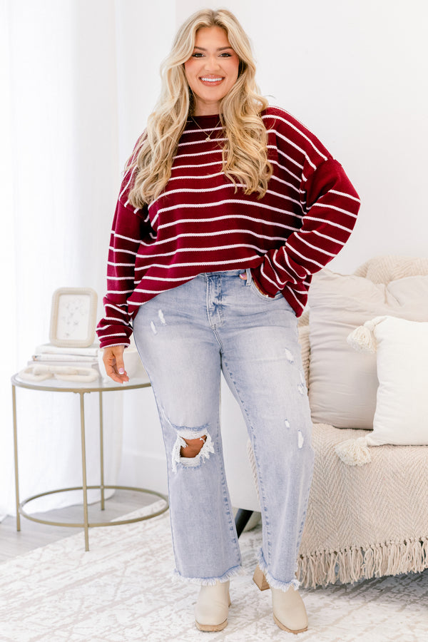 Chic Soul plus size clothing, light wash jeans with distressed details throughout and a hole in the right knee as well as two front pockets