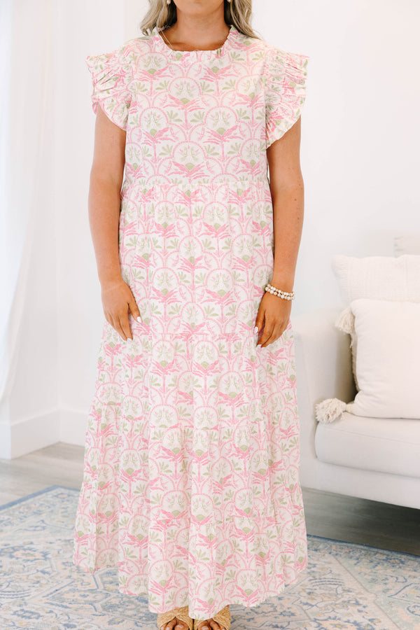 Plus size pink and green floral maxi dress with ruffle sleeves and a flowy tiered silhouette.
