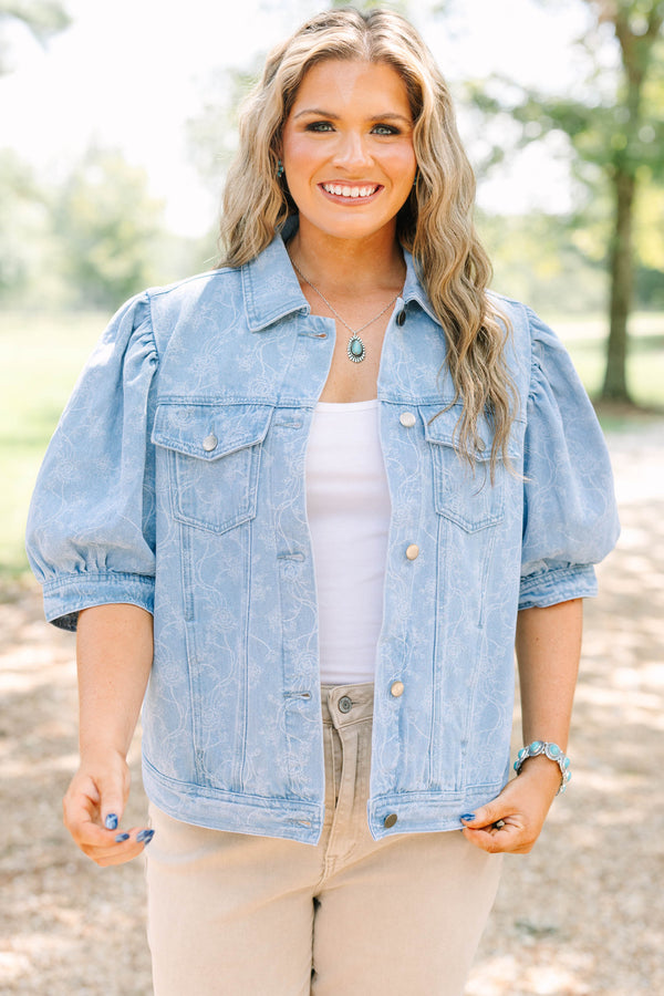 Plus Size light wash denim jacket with floral embroidery, puff sleeves, and silver buttons.