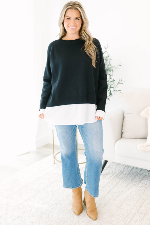 Chic Soul plus size clothing, black long sleeve knit sweater top with round neckline and cuff sleeves with white button up shirt underneath peeking out the bottom and sleeves