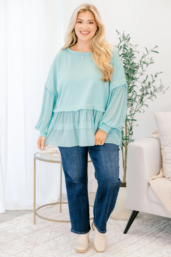 Chic Soul plus size clothing, seafoam blue long sleeve top with round neckline and cuff sleeves with tiered ruffle detail along the bottom