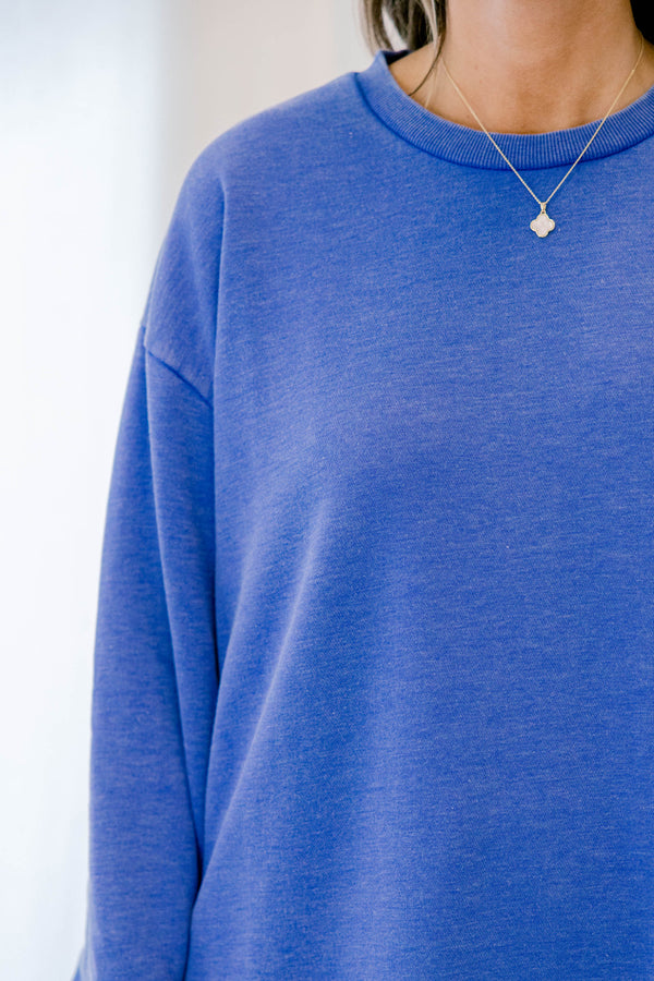 Chic Soul plus size clothing, royal blue long sleeve curved hem top with exposed seam at the waistband 
