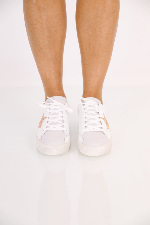 White low-top lace-up sneakers with a silver metallic base and a gold glitter star accent.
