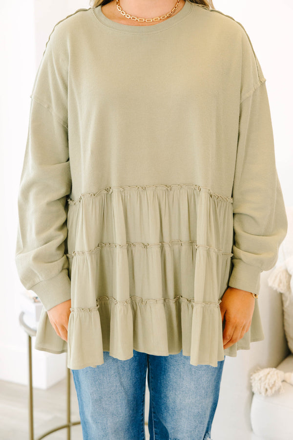 Chic Soul plus size clothing, olive long sleeve top with round neckline and cuff sleeves with tiered ruffle detail along the bottom
