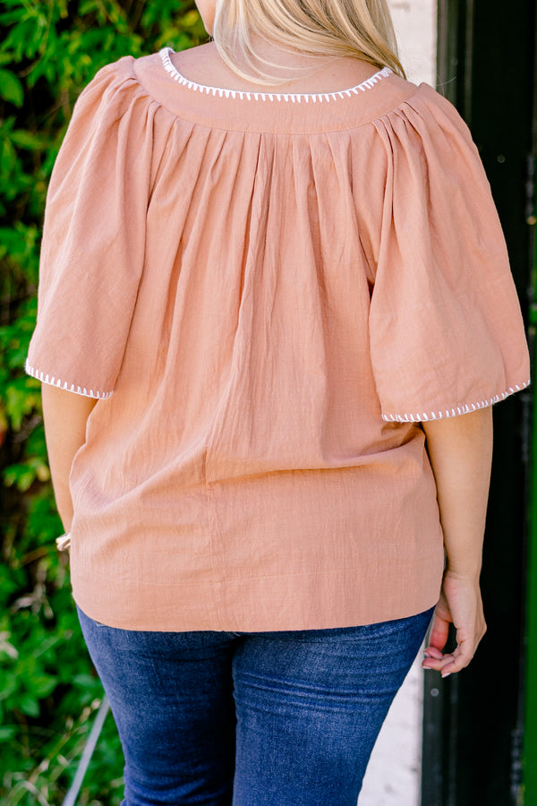 Chic Soul plus size clothing , brown top with bell sleeves that have white stitching details on the ends of the sleeves and along the v-neckline 
