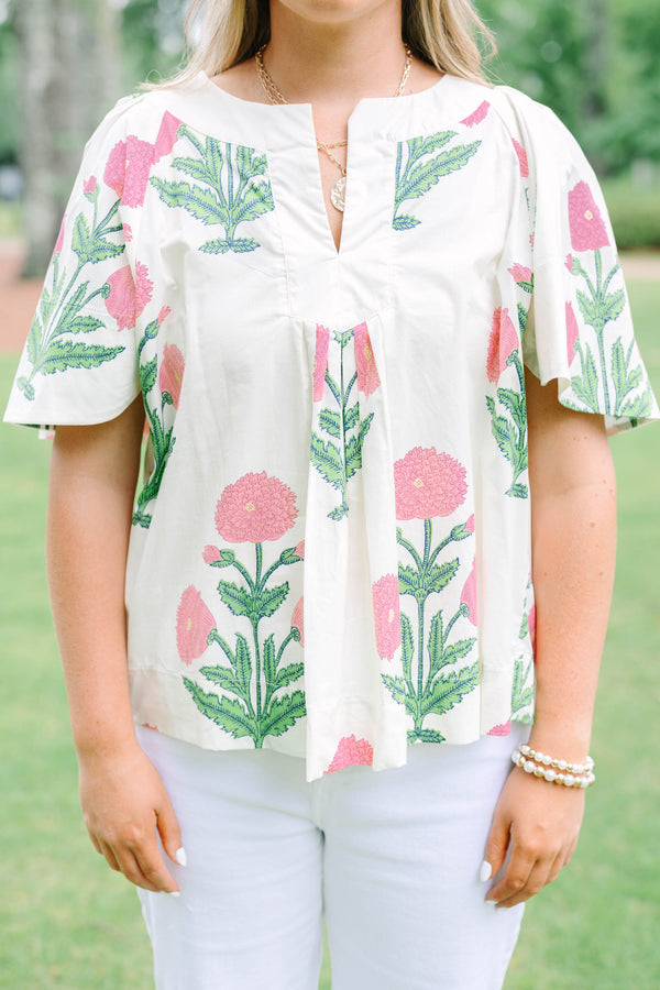 Plus Size cream floral top with pink and green block print, flutter sleeves, and a notched neckline.