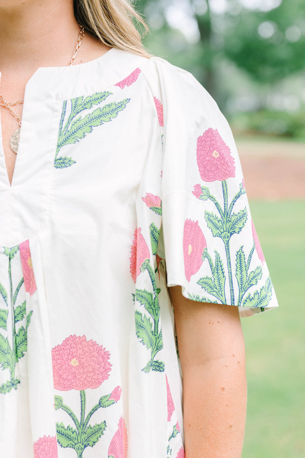 Plus Size cream floral top with pink and green block print, flutter sleeves, and a notched neckline.