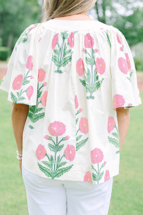 Plus Size cream floral top with pink and green block print, flutter sleeves, and a notched neckline.
