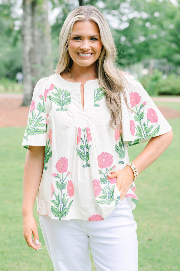 Plus Size cream floral top with pink and green block print, flutter sleeves, and a notched neckline.