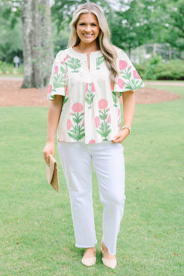 Plus Size cream floral top with pink and green block print, flutter sleeves, and a notched neckline.