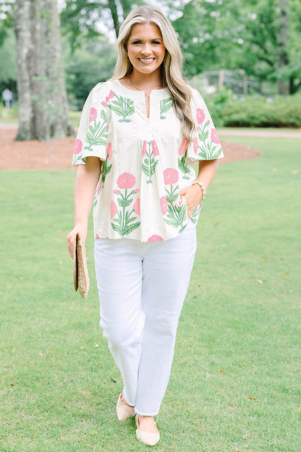 Plus Size cream floral top with pink and green block print, flutter sleeves, and a notched neckline.