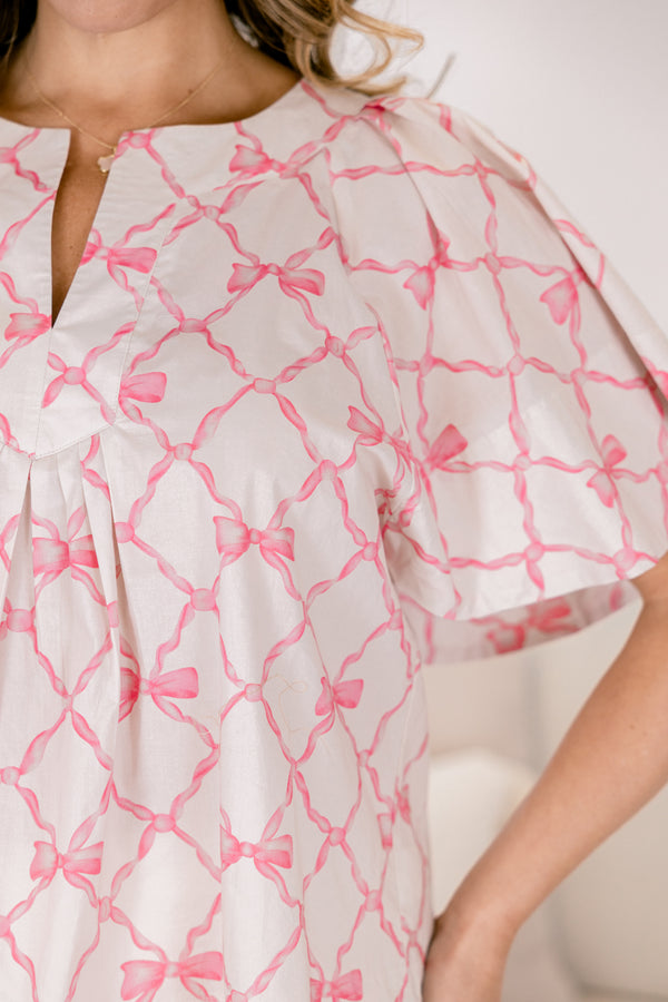 Chic Soul plus size clothing, pink bow pattern short bell sleeve baby doll top with v neckline cutout