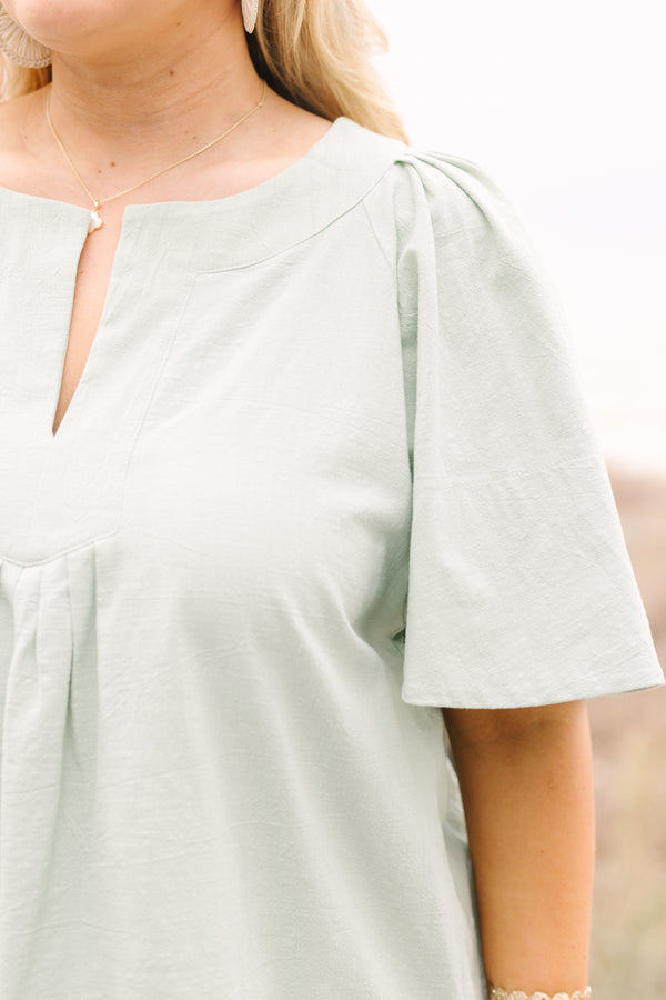Chic Soul plus size clothing, sage top with short bell sleeves a slight v-neckline and rouching under the center of the chest 
