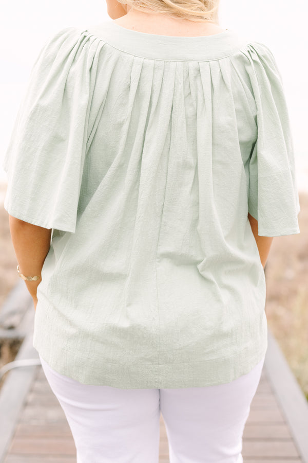 Chic Soul plus size clothing, sage top with short bell sleeves a slight v-neckline and rouching under the center of the chest 
