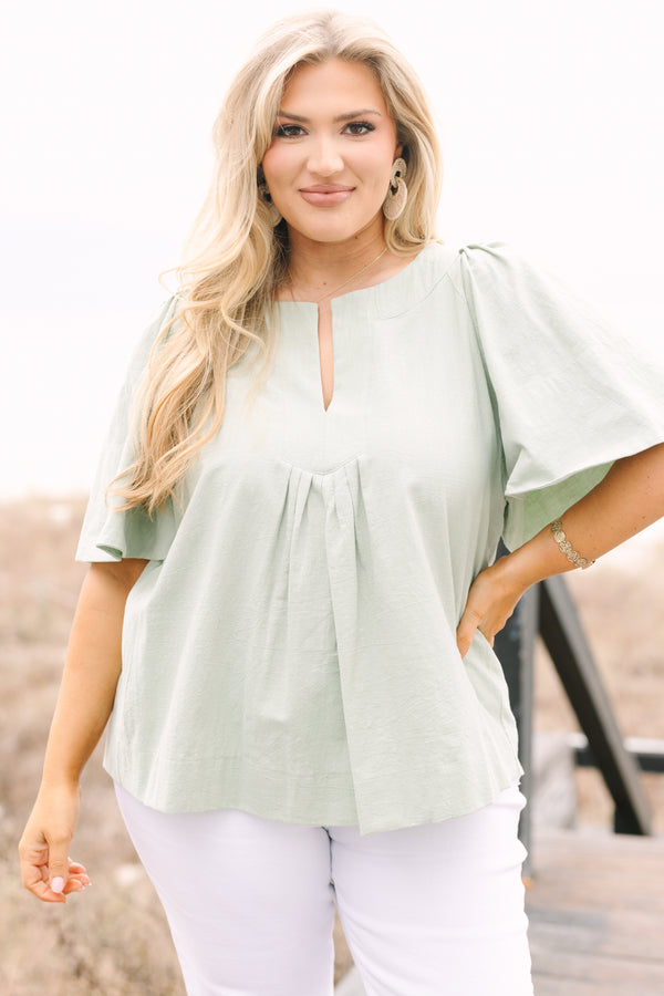 Chic Soul plus size clothing, sage top with short bell sleeves a slight v-neckline and ruching under the center of the chest 
