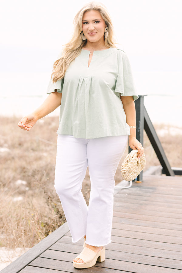 Chic Soul plus size clothing, sage top with short bell sleeves a slight v-neckline and ruching under the center of the chest 
