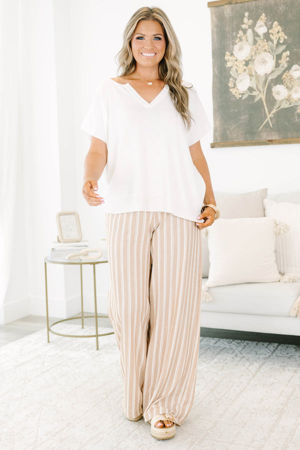 Plus Size khaki and off-white vertical striped wide-leg pants with a relaxed fit.