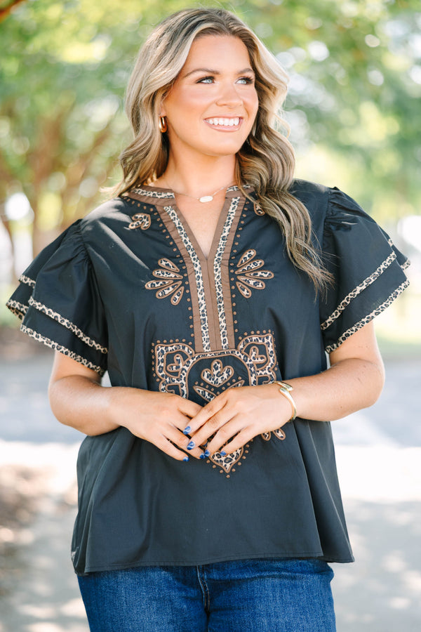 Plus Size black top with leopard print embroidery, V-neckline, and tiered flutter sleeves.