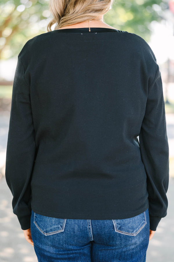 Plus size black long sleeve top with a satin V-neckline and ribbed cotton fabric.
