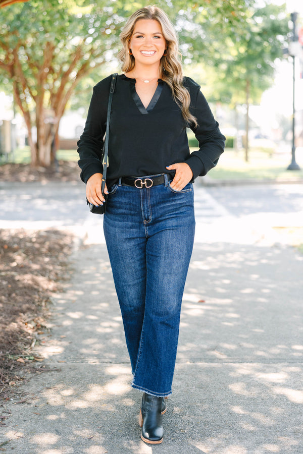 Plus size black long sleeve top with a satin V-neckline and ribbed cotton fabric.