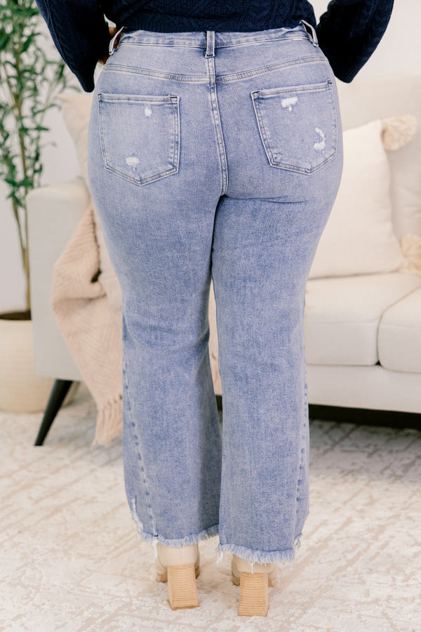 Chic Soul plus size clothing, medium wash denim flare slightly cropped jeans with frayed edges and distressing near the bottom of the right front pocket