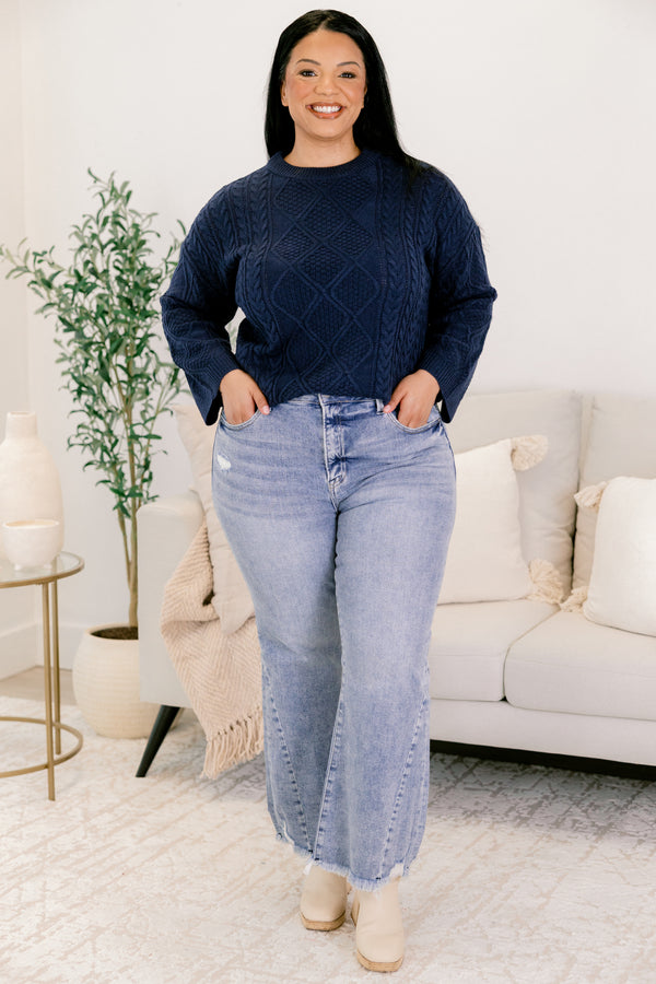 Chic Soul plus size clothing, medium wash denim flare slightly cropped jeans with frayed edges and distressing near the bottom of the right front pocket