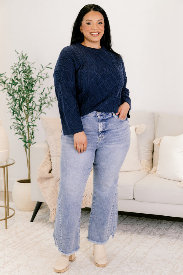 Chic Soul plus size clothing, medium wash denim flare slightly cropped jeans with frayed edges and distressing near the bottom of the right front pocket