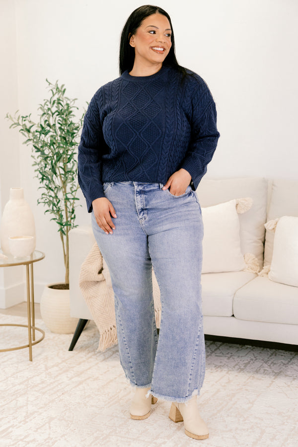Chic Soul plus size clothing, medium wash denim flare slightly cropped jeans with frayed edges and distressing near the bottom of the right front pocket