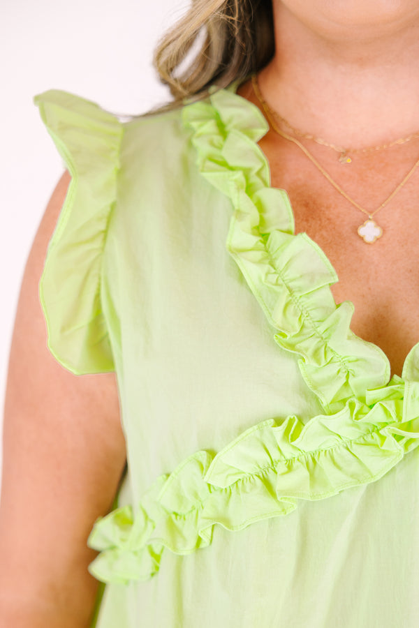 Plus Size light green cotton top with flutter sleeves, ruffle trim, and a V-neckline.