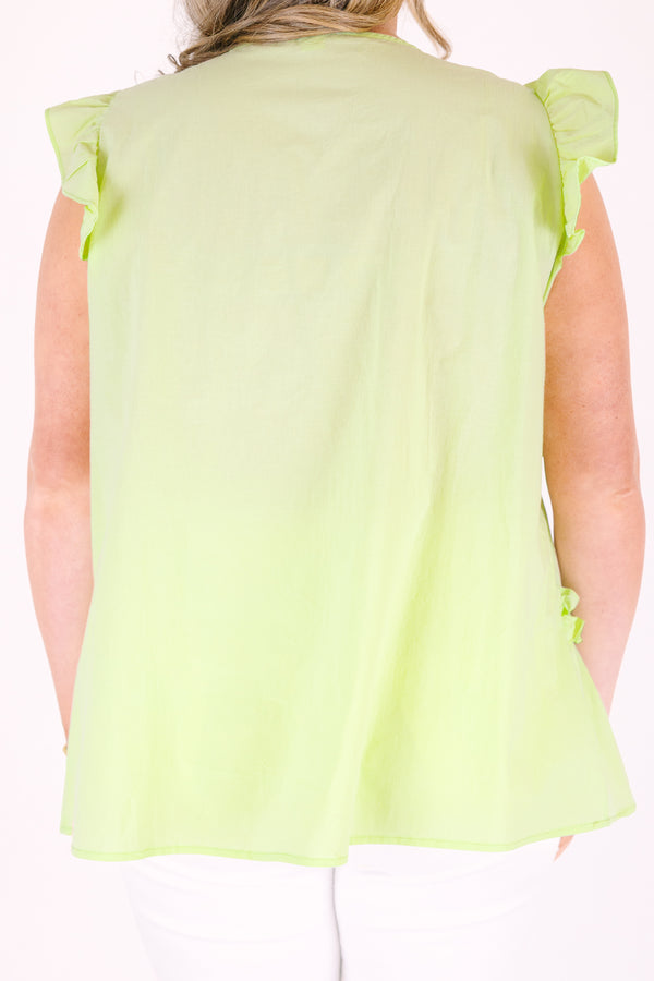 Plus Size light green cotton top with flutter sleeves, ruffle trim, and a V-neckline.