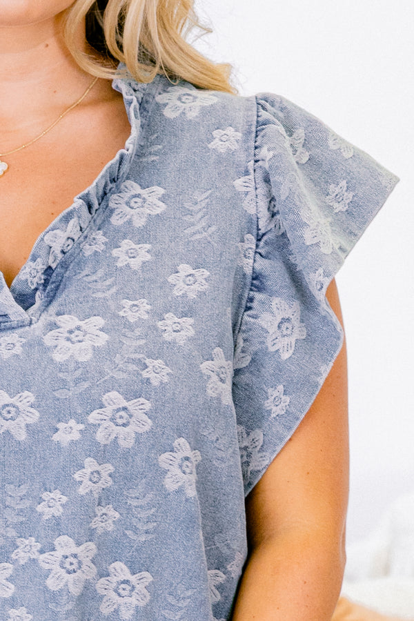 Chic Soul plus size clothing, short-flutter-sleeve denim blue top with a ruffled v-neckline and a subtle lighter wash floral pattern