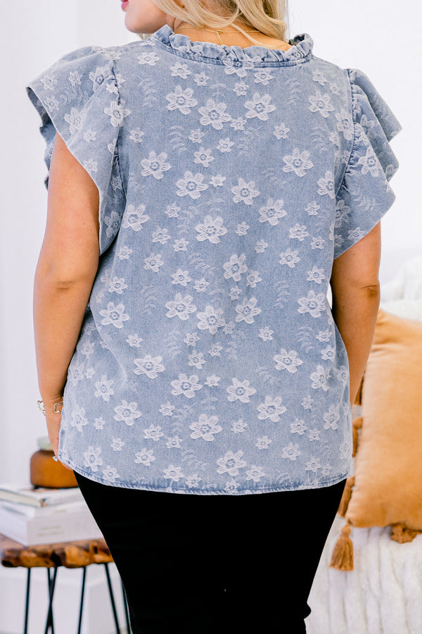 Chic Soul plus size clothing, short-flutter-sleeve denim blue top with a ruffled v-neckline and a subtle lighter wash floral pattern