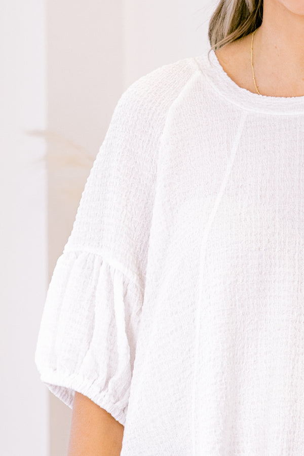 Chic Soul plus size clothing, white short sleeve blouse with round neckline and bubble sleeve detail along the bottom 