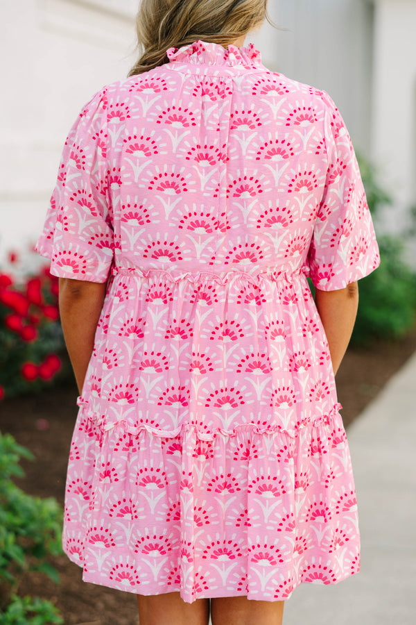 Plus Size fuchsia and light pink patterned tiered mini dress with short sleeves and tassel ties.